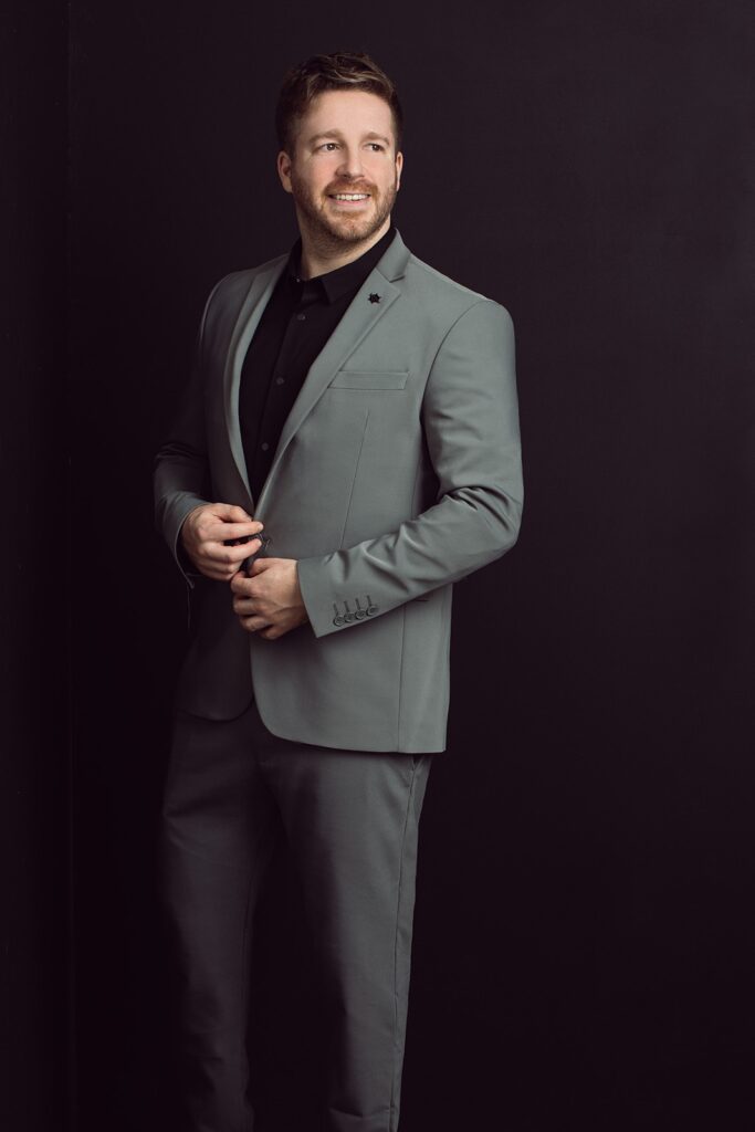 Portrait of Shahaf Brumer photographer in a formal suit